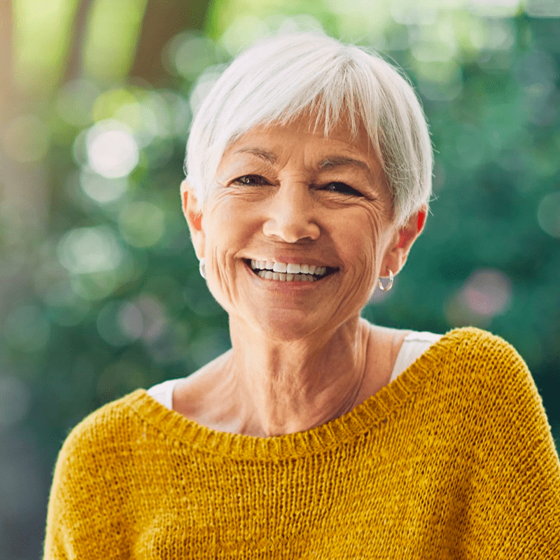 Older woman in yellow sweater